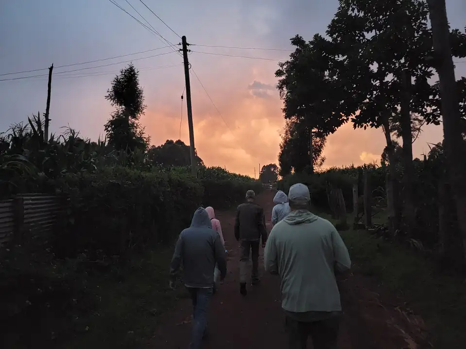 Walking a red dirt road at dusk